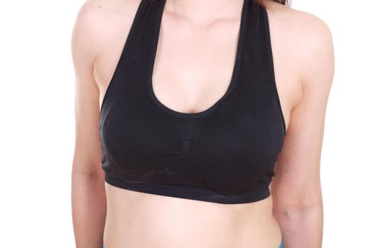 close up of a woman's chest in her sports bra.