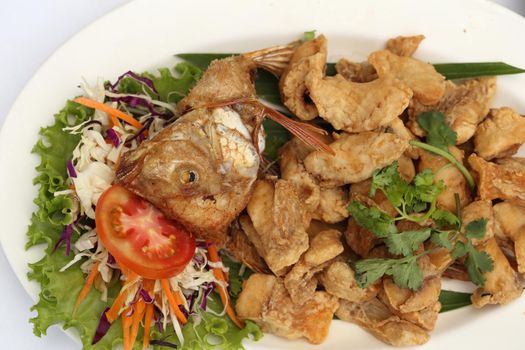 fried fish (Complementing fish) on white table  in restaurant