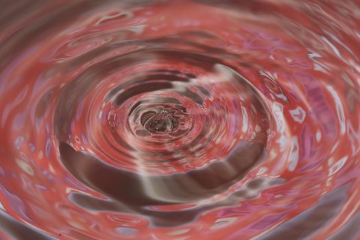 Close-up macro of a wave from water drop droplet