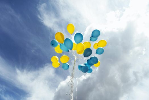 Flying in the sky yellow - blue balls.