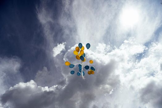 Flying in the sky yellow - blue balls.