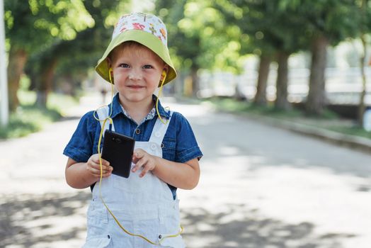 Cute boy posing for photo outdoors. Ukraine. Europe