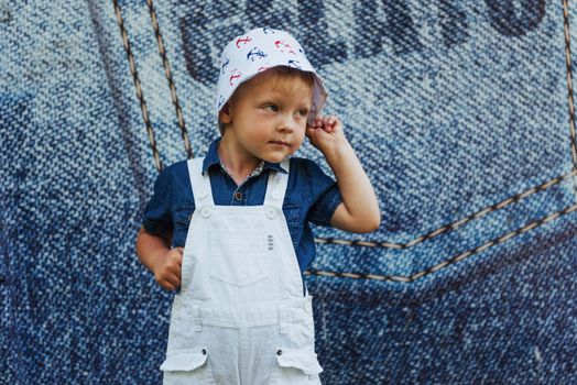 Cute boy posing for photo outdoors Ukraine. Europe.