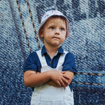 Cute boy posing for photo outdoors Ukraine. Europe.