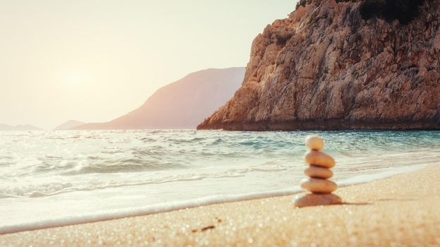 Scenic view of sandy beach and surf waves on the shore