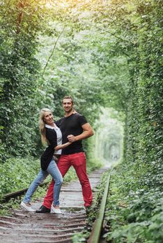 Loving couple on the iron road. Ukraine. Klevan
