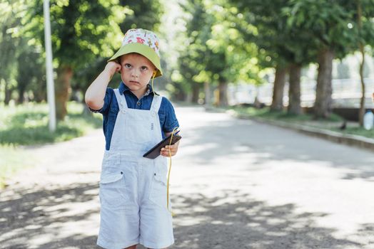 Cute boy posing for photo outdoors. Ukraine. Europe