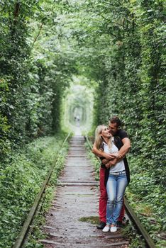 Loving couple on the iron road. Ukraine. Klevan