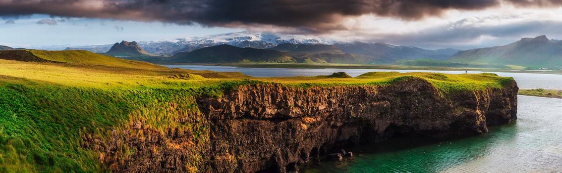 Reynisfjara black sand beach in Iceland. Reynisfyal Mountains.