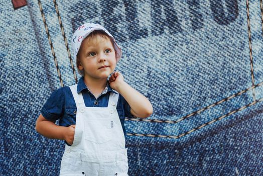 Cute boy posing for photo outdoors Ukraine. Europe.
