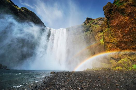 Great waterfall Skogafoss in south of Iceland near the town of Skogar. Colorful rainbow color.