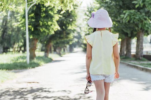 Beautiful girl in a summer sunny day.