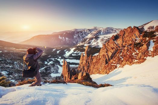 tourist looks at the landscape. Beautiful sunset. Spring landscape. Carpathians Ukraine Europe