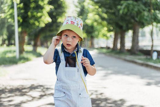 Cute boy posing for photo outdoors. Ukraine. Europe