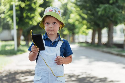 Cute boy posing for photo outdoors. Ukraine. Europe
