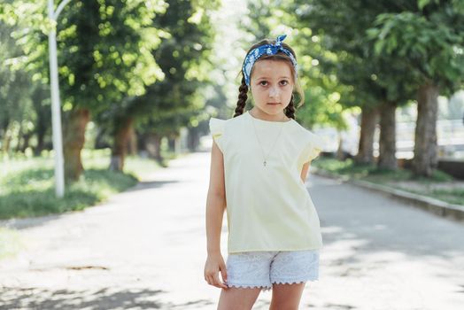 Beautiful girl in a summer sunny day.