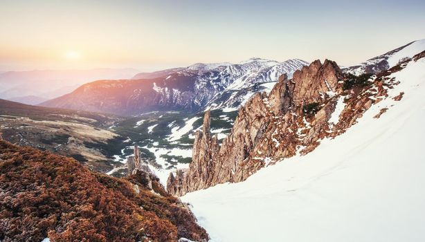 Colorful spring sunset over the mountain ranges in the national park Carpathians. Ukraine, Europe.