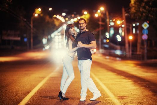 young couple dancing on the road. Ukraine. Europe