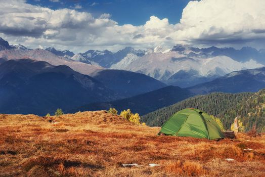 Tent green spread out on the pass Goulet. Georgia, Svaneti. Europe. Caucasus Mountains.