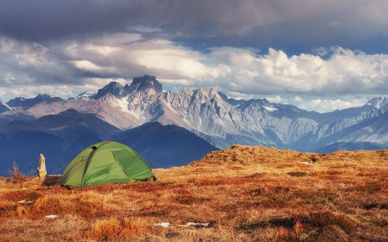 Tent green spread out on the pass Goulet. Georgia, Svaneti. Europe. Caucasus Mountains.