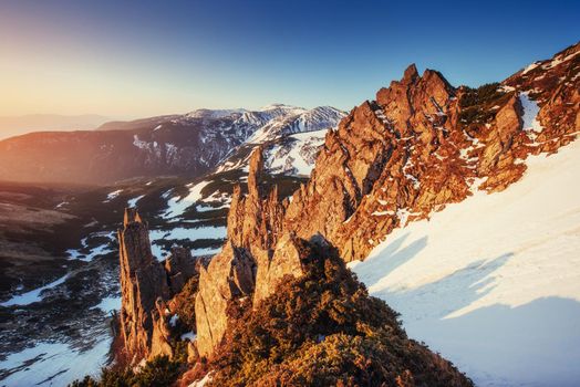 Colorful spring sunset over the mountain ranges in the national park Carpathians. Ukraine, Europe.