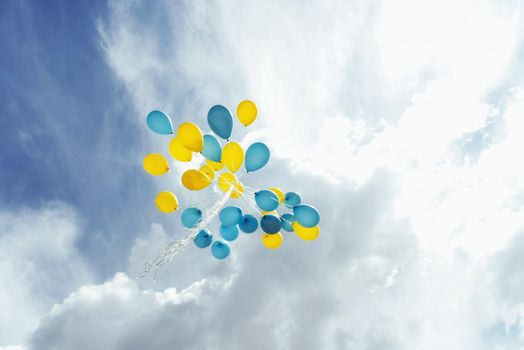 Flying in the sky yellow - blue balls.