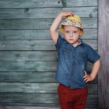 Happy little boy, child in a Panama hat.