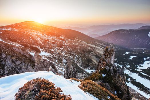 Colorful spring sunset over the mountain ranges in the national park Carpathians. Ukraine, Europe.