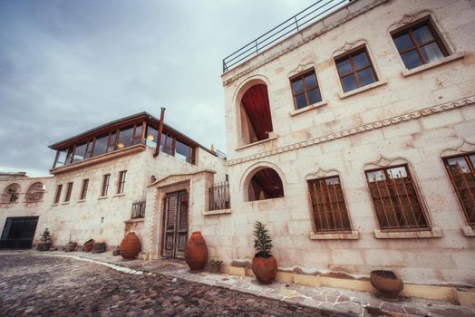 Old traditional Ottoman house in the background.