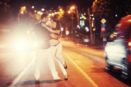 young couple dancing on the road. Ukraine. Europe