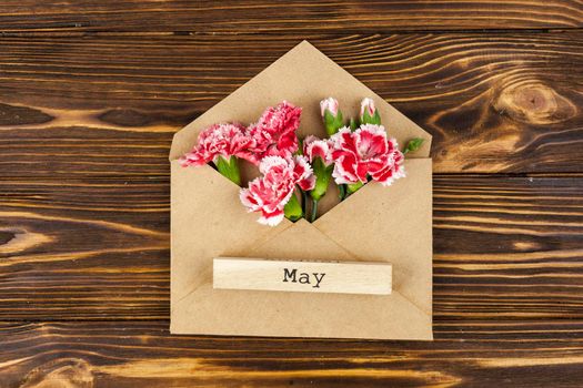 may text wooden block envelope with red carnation flowers