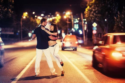 young couple dancing on the road. Ukraine. Europe