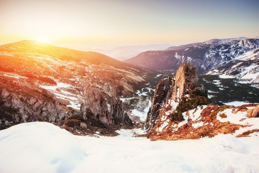 Colorful spring sunset over the mountain ranges in the national park Carpathians. Ukraine, Europe.