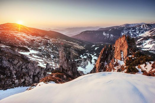 Colorful spring sunset over the mountain ranges in the national park Carpathians. Ukraine, Europe.