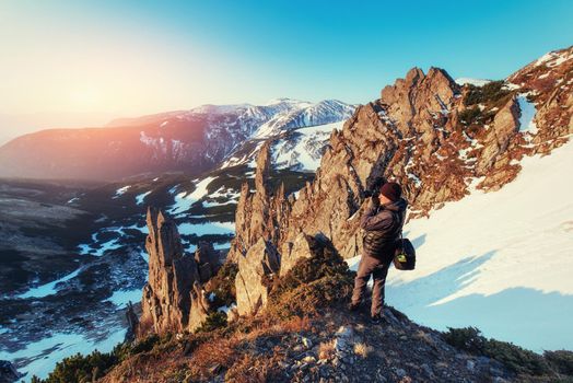 tourist looks at the landscape. Beautiful sunset. Spring landscape. Carpathians Ukraine Europe