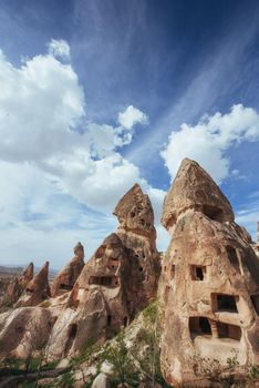Review unique geological formations in Cappadocia, Turkey. Kappadokiets region, with its valleys, gorges, hills, located between the volcanic mountains in Goreme National Park.