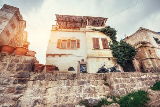 Old traditional Ottoman house in the background.