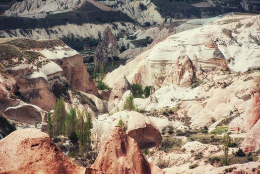 Beauty geological formations in Cappadocia, Turkey. Cappadocia with its valley, ravine, hills, located between the volcanic mountains in Goreme National Park.