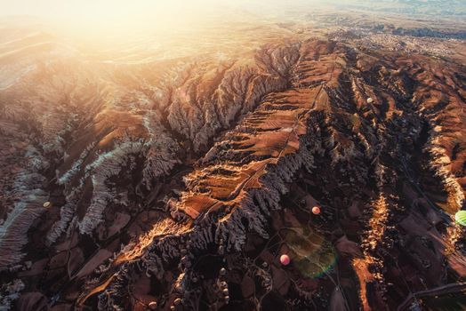 Fantastic sunrise over the Red Valley in Cappadocia, Anatolia, Turkey. Volcanic mountains in Goreme National Park.