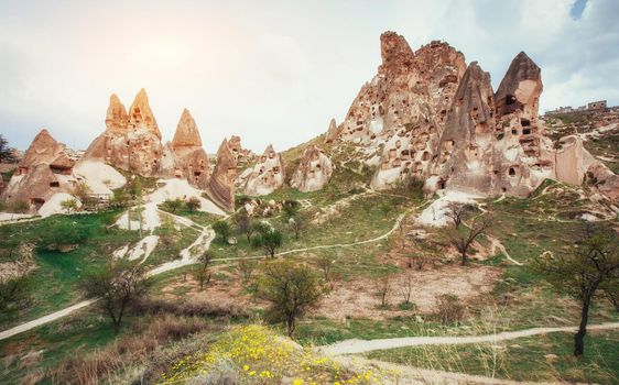 Review unique geological formations in Cappadocia, Turkey. Kappadokiets region, with its valleys, gorges, hills, located between the volcanic mountains in Goreme National Park.
