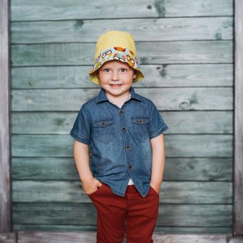 Happy little boy, child in a Panama hat.