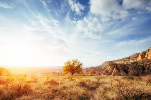 Fantastic sunrise over the Red Valley in Cappadocia, Anatolia, Turkey. Volcanic mountains in Goreme National Park.