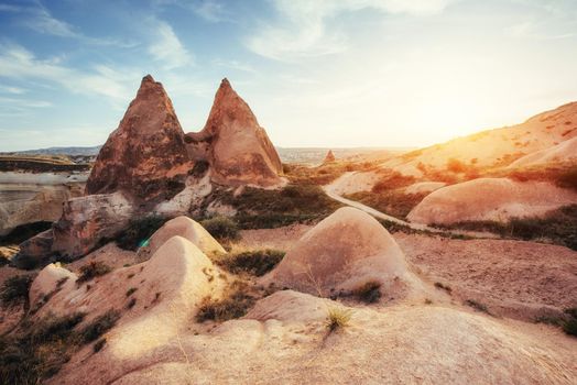 Fantastic sunrise over the Red Valley in Cappadocia, Anatolia, Turkey. Volcanic mountains in Goreme National Park.