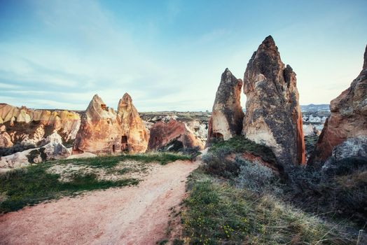 Review unique geological formations in Cappadocia, Turkey. Kappadokiets region, with its valleys, gorges, hills, located between the volcanic mountains in Goreme National Park.