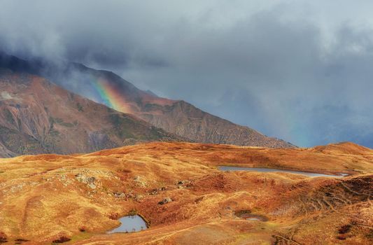 Sunset on mountain lake Koruldi. Upper Svaneti, Georgia, Europe. Caucasus mountains