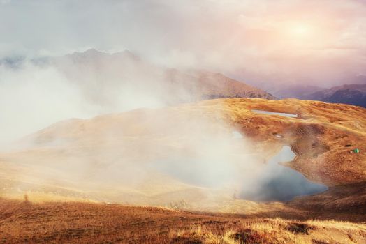Sunset on mountain lake Koruldi. Upper Svaneti, Georgia, Europe. Caucasus mountains