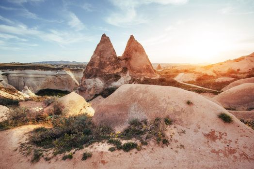 Fantastic sunrise over the Red Valley in Cappadocia, Anatolia, Turkey. Volcanic mountains in Goreme National Park.