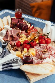 big group of meat, bread and vegetables.