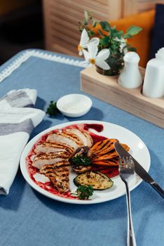 Grilled vegetables and chicken fillet. Traditional cuisine. Grill kitchen.
