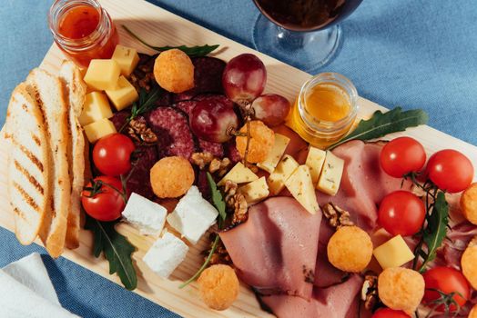big group of meat, bread and vegetables.